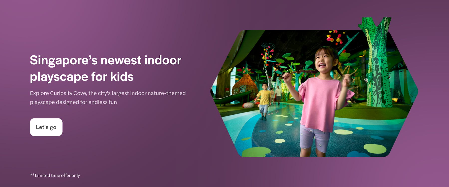 Children playing at Curiosity Cove Main Entrance with colorful indoor playground.